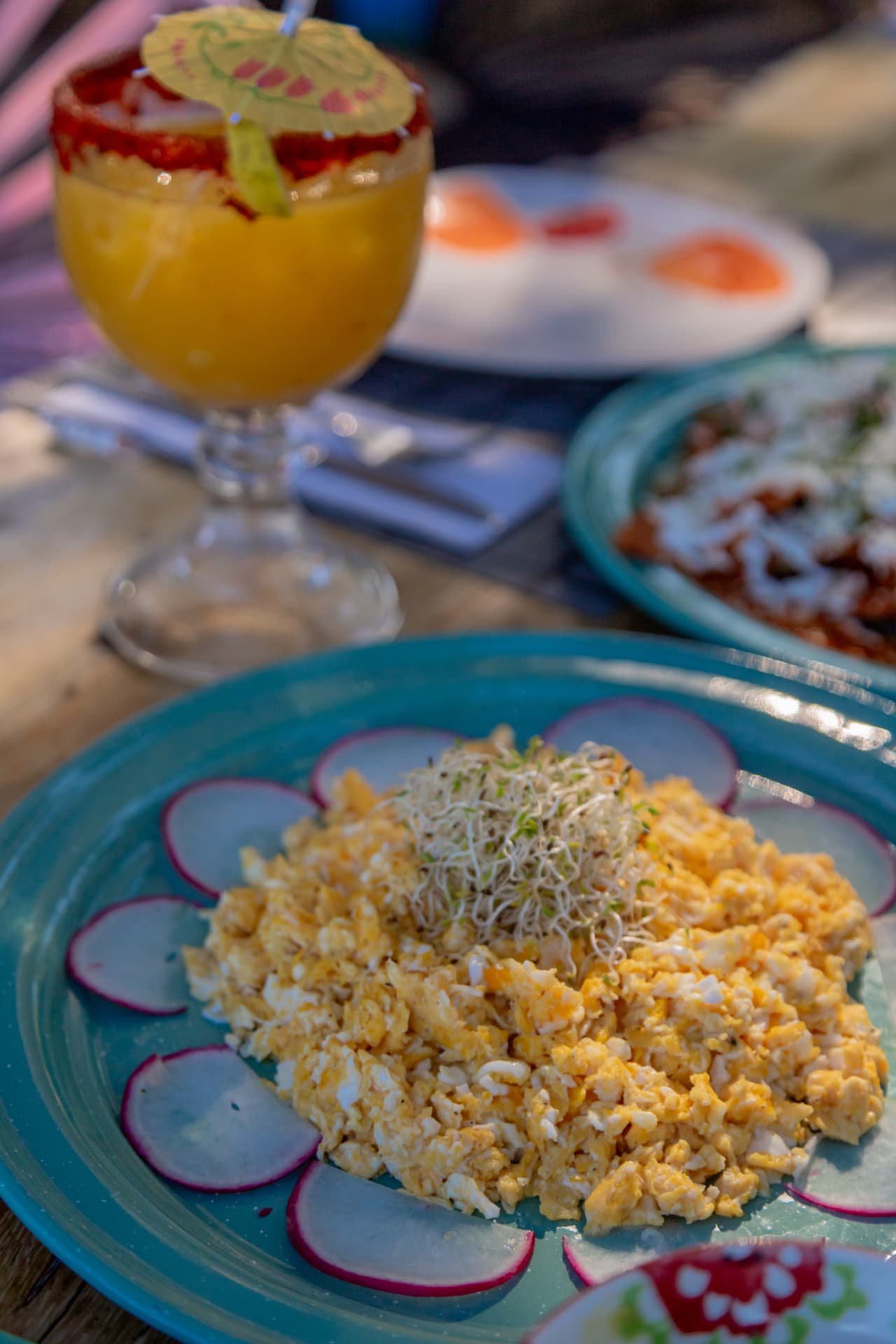 Eggs with sprouts and a mango cocktail at the beach club