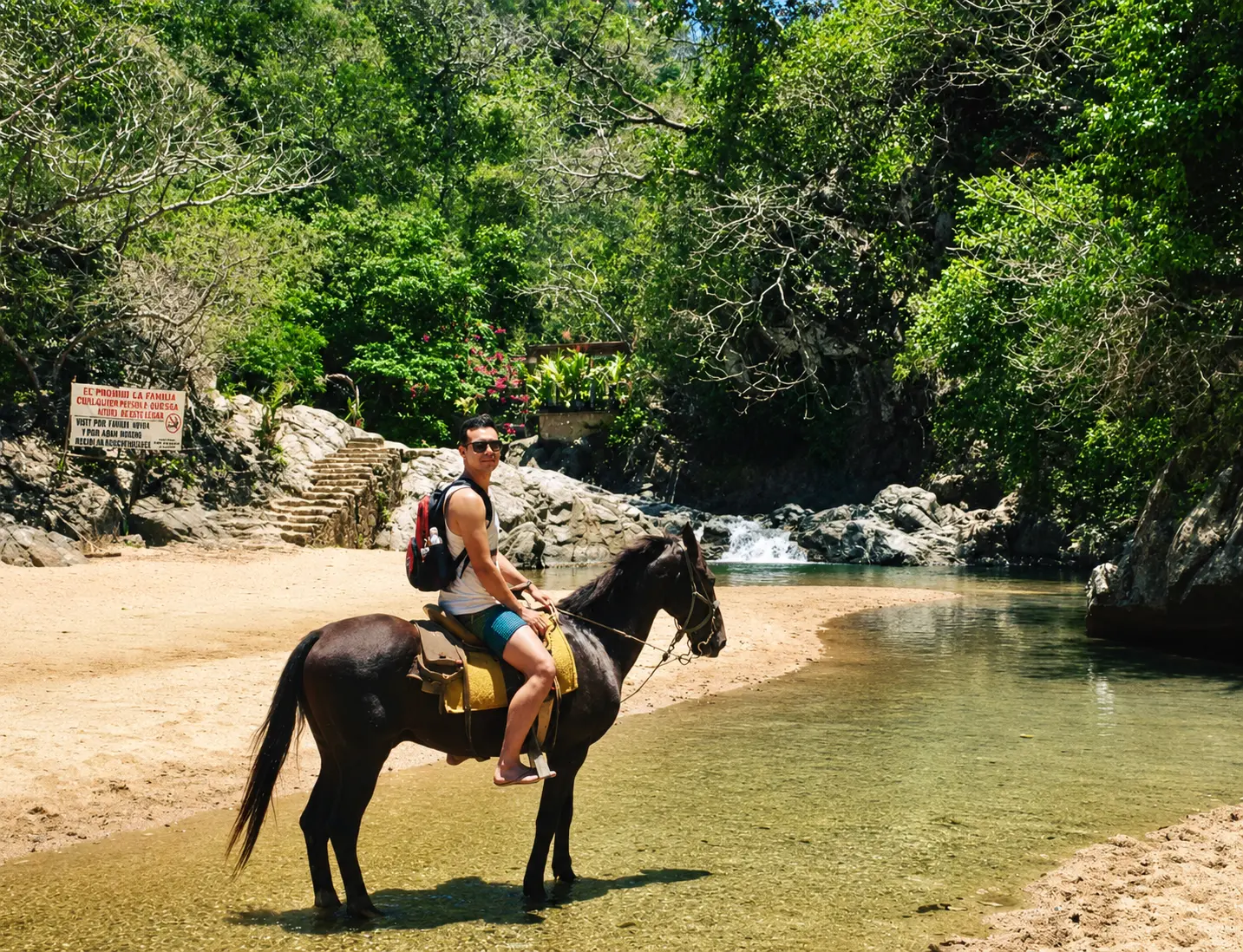 Horseback ride along the Quimixto river toward the waterfall, Puerto Vallarta