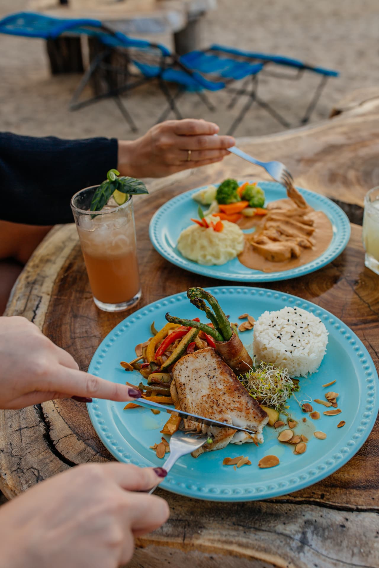 Fish and chicken in sauce served on the beach