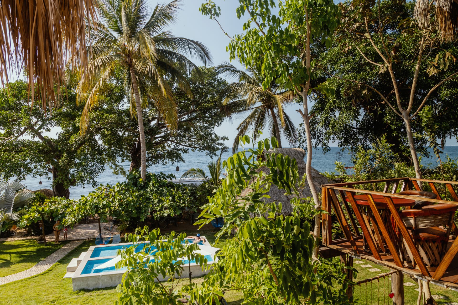 Elevated view of the garden, pool and ocean
