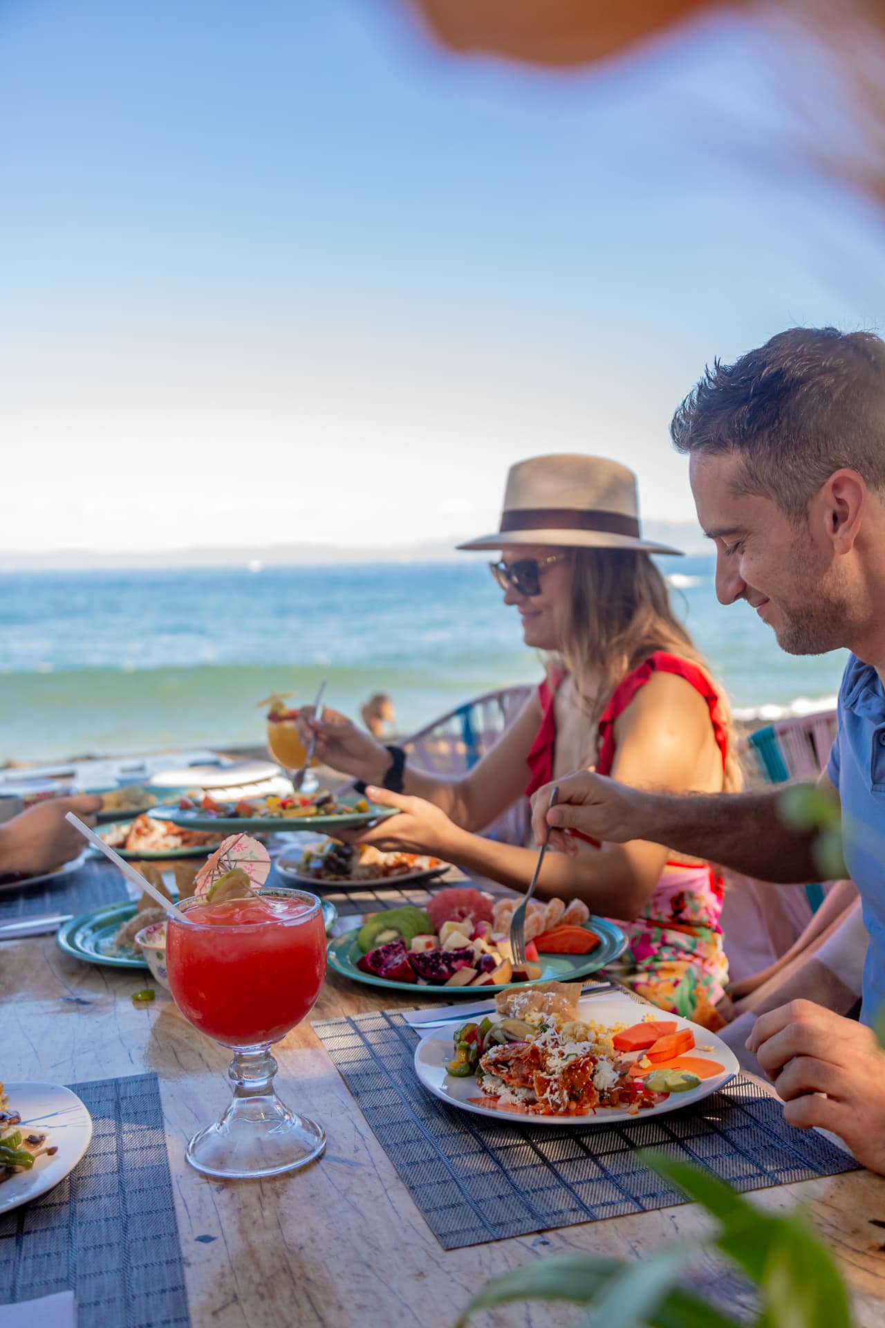 Couple dining at the beach club table with an ocean view