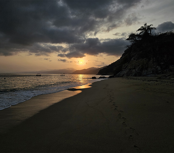 Dramatic sunset on Quimixto beach