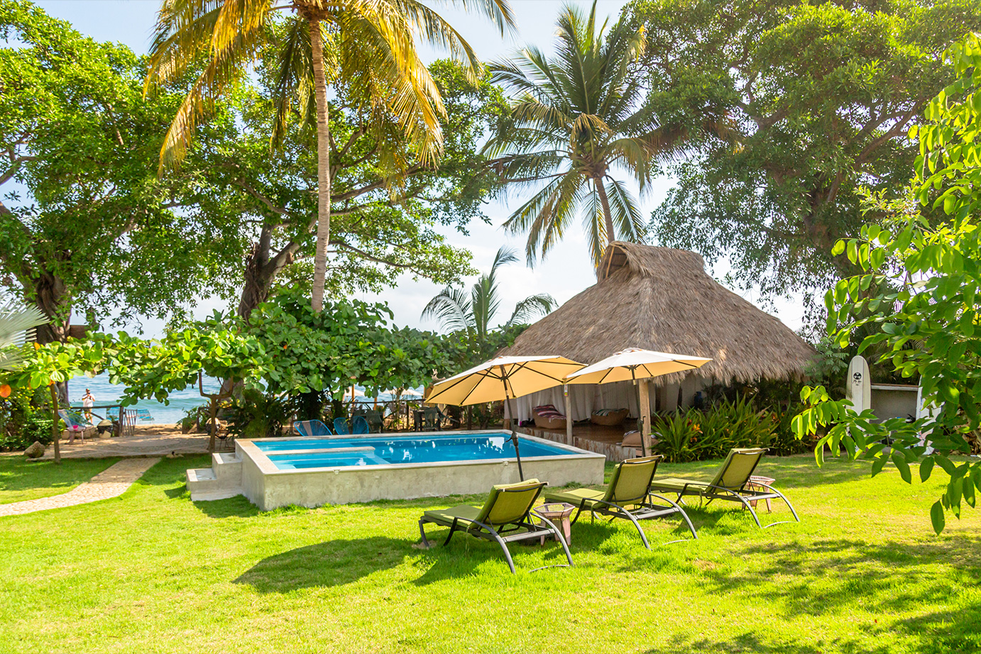 Pool and tropical garden at Amaca Beach