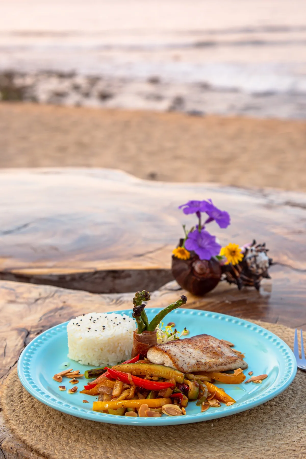 Dish served by the ocean at Amaca Beach