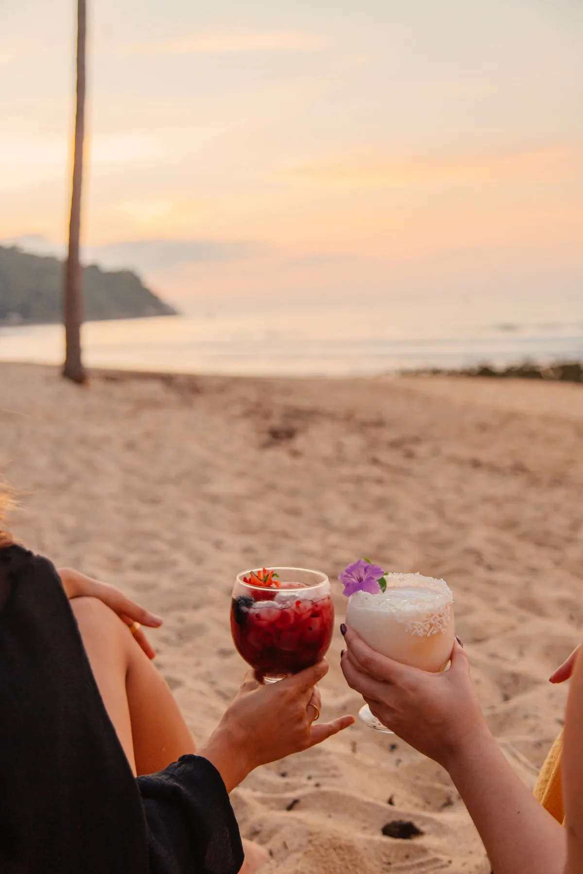 Cocktails at sunset on the beach at Amaca Beach