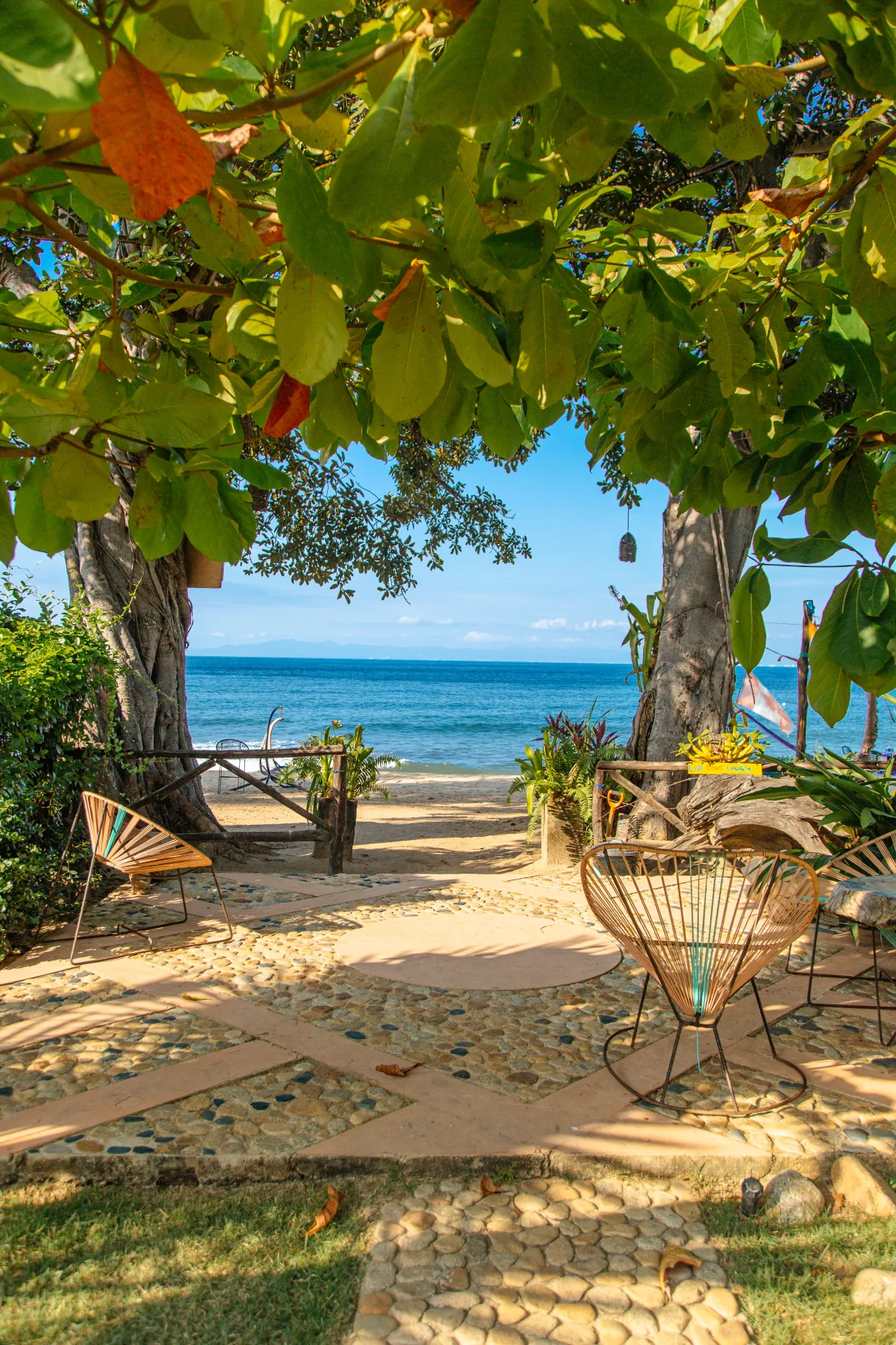 Lounge chairs by the sea at Amaca Beach